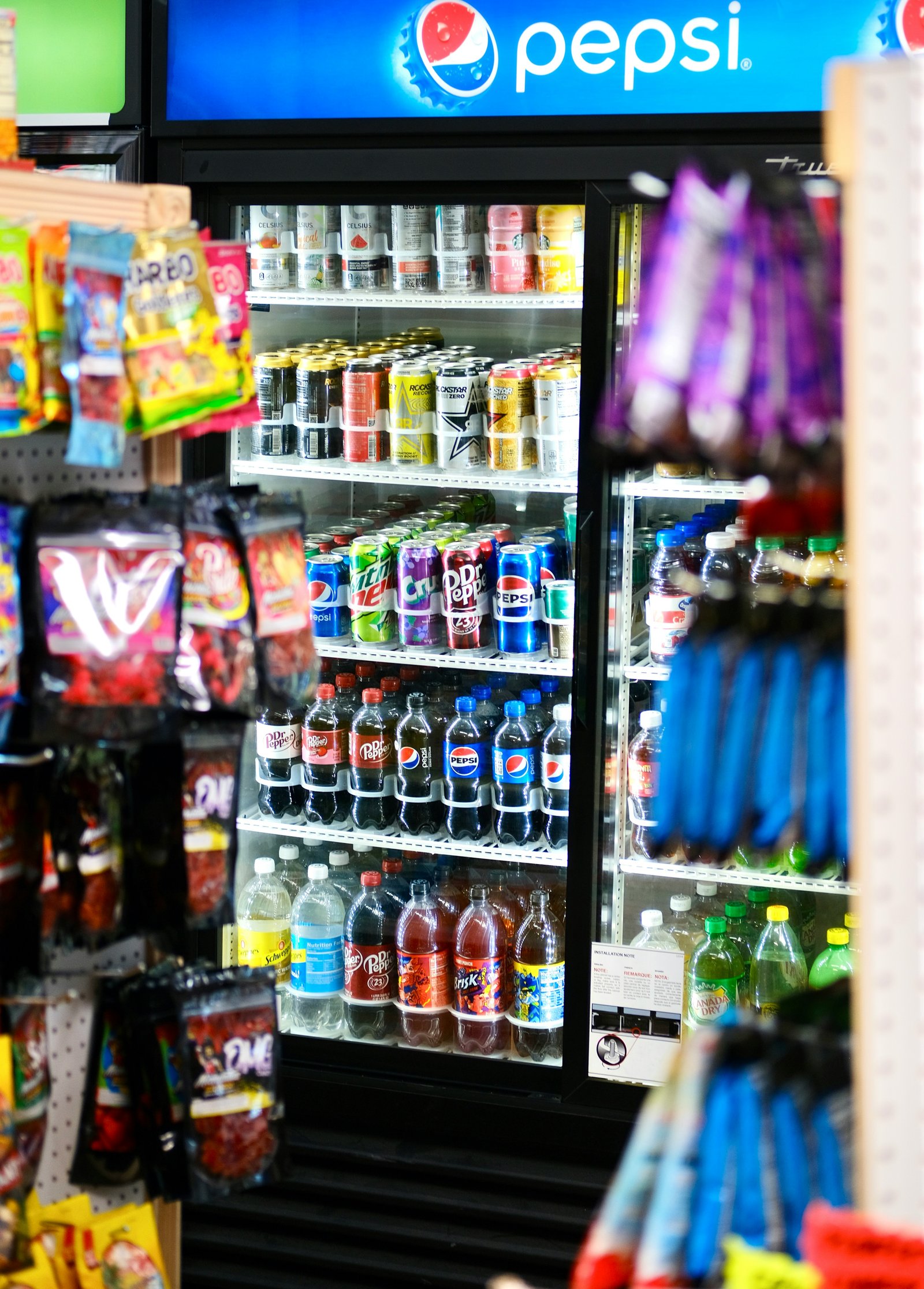 Happy employees enjoying snacks from BiteBuddy vending machine